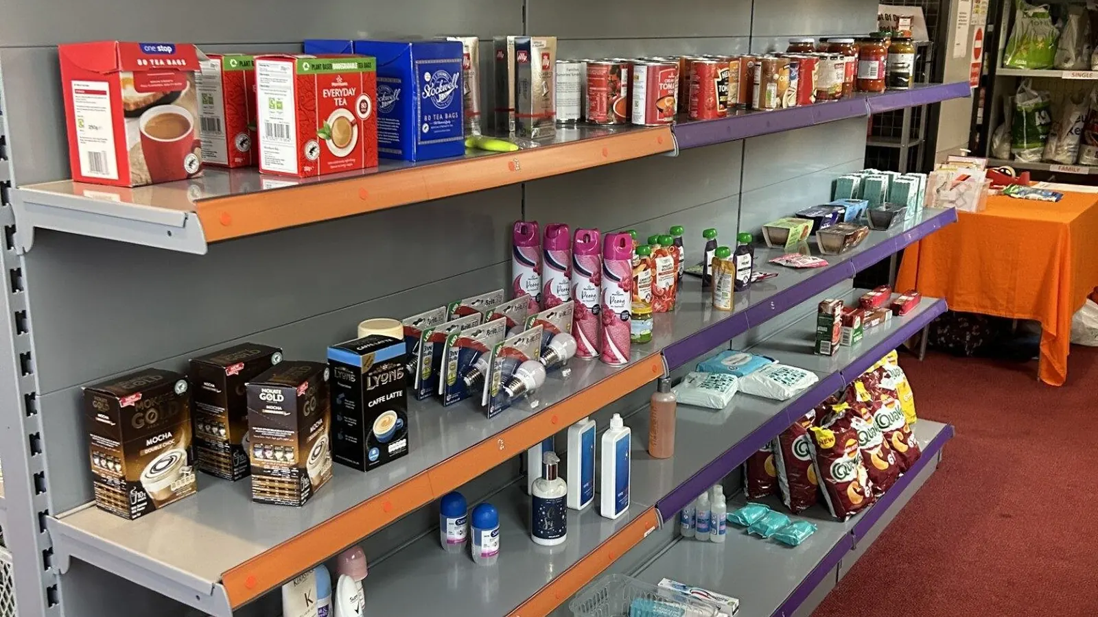Grocery shelves with food and household supplies for community support